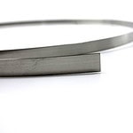 Close up view of a stainless steel strap.