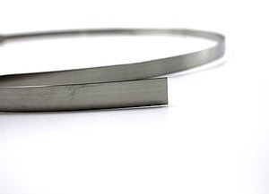Close up view of a stainless steel strap.