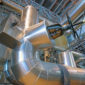 Equipment, cables and piping as found inside of a modern industrial power plant