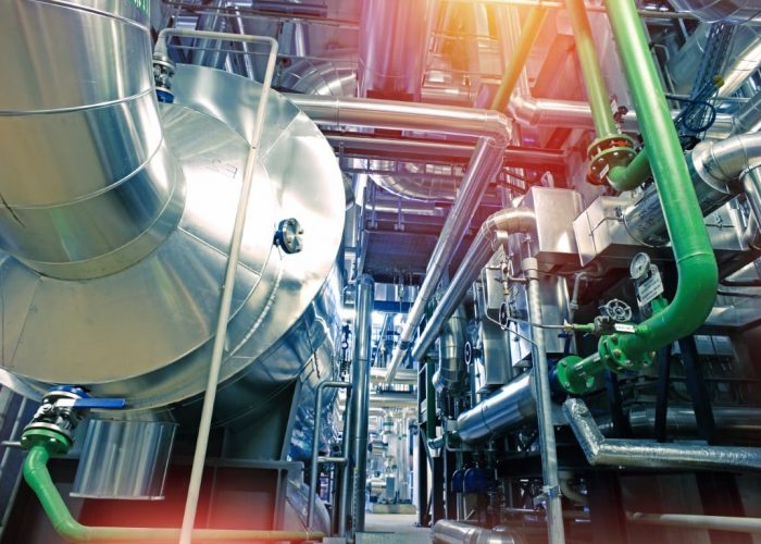 Equipment, cables and piping as found inside of a modern industrial power plant