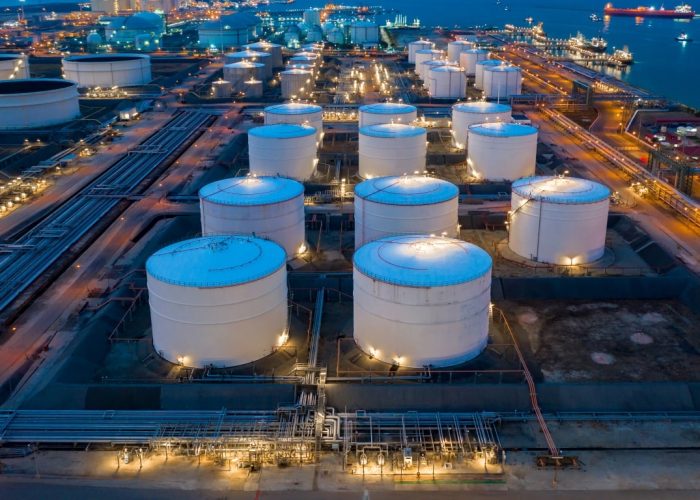 Aerial view oil and gas terminal storage tank farm,Tank farm storage chemical petroleum petrochemical refinery product, Business commercial trade fuel and energy transport by tanker vessel.